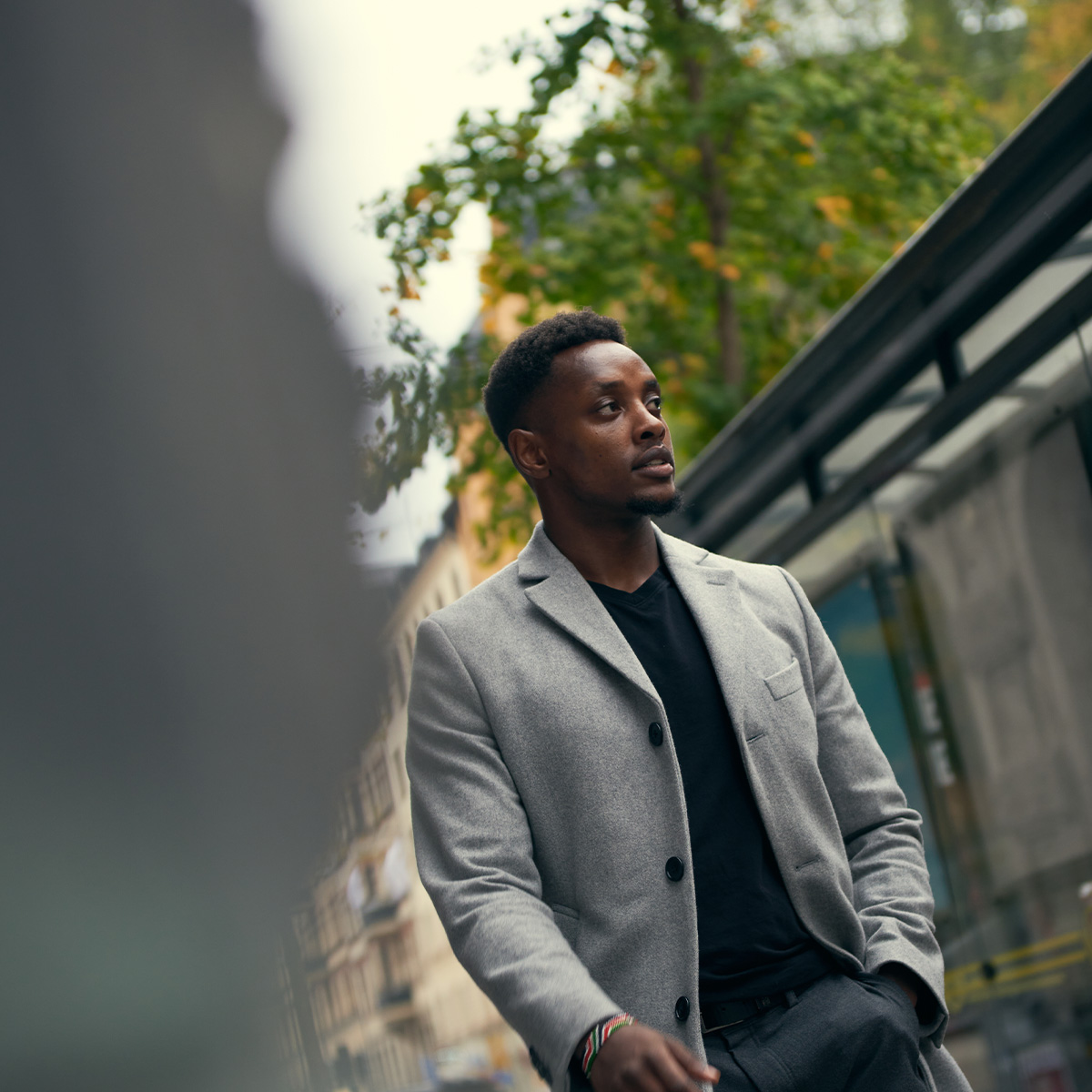 Man walking in grey coat